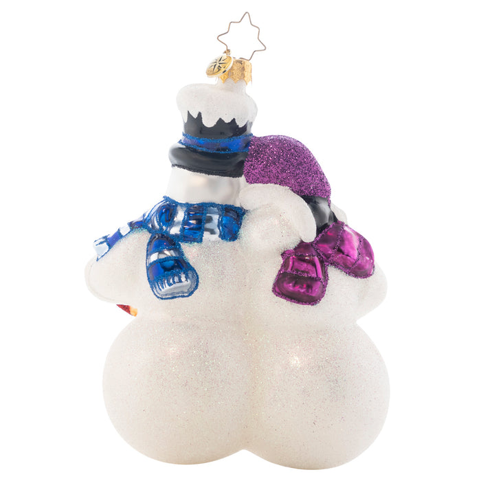 Back - Ornament Description - Winterland Fun: This lovely snow couple are hoping excitedly for a white Christmas. Judging from the snowy layer on the top hat, they'll probably get their wish! Add your own personal message or your family's name to the front of this snow couple's sleigh. Note: Please allow approximately one week (on top of shipping time) for our elves to personalize your ornament.